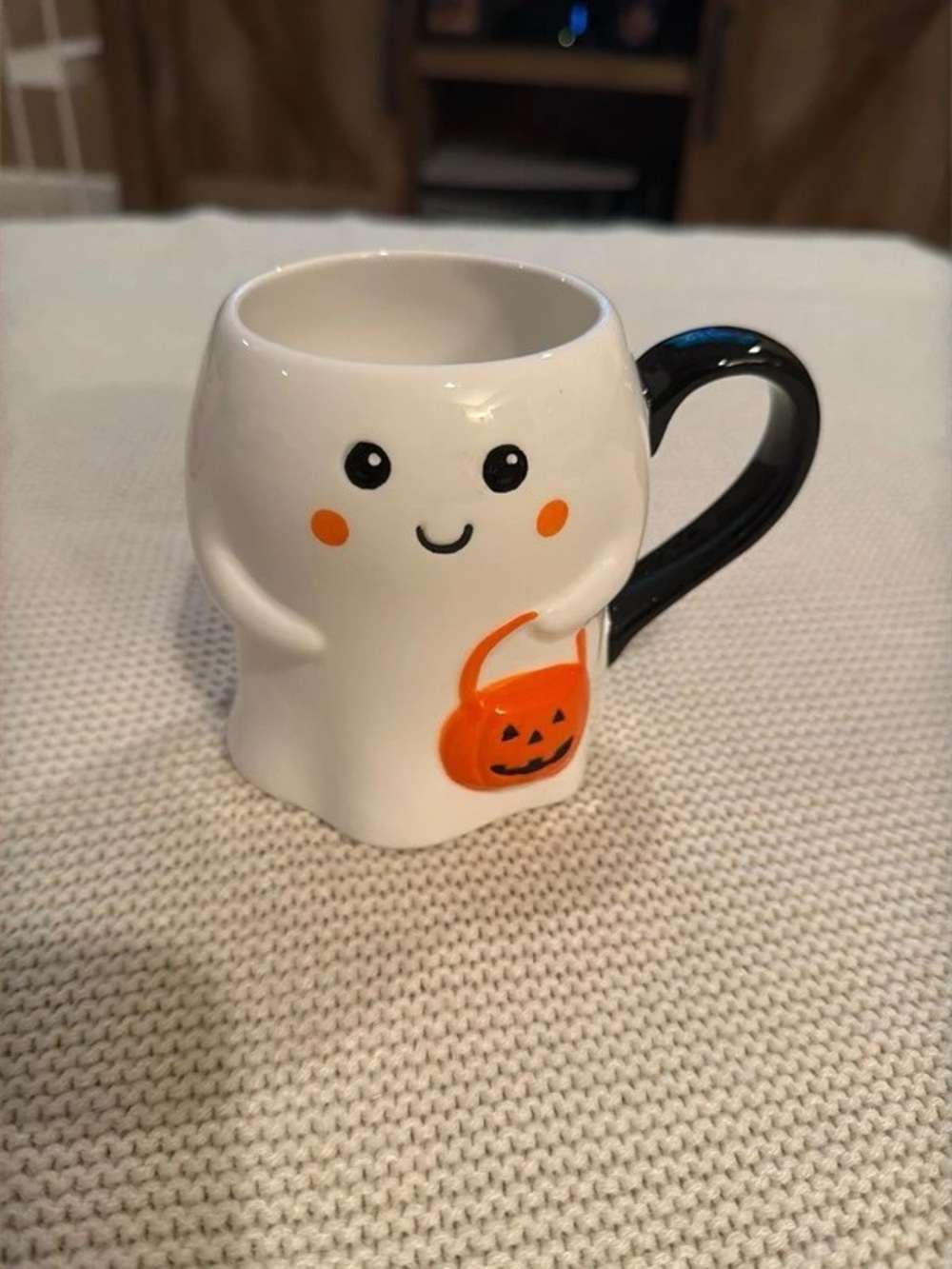 White Ghost Ceramic Mug with Black Handle and Orange Pumpkin Accent